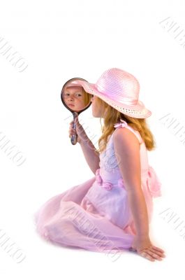 young girl holding a mirror