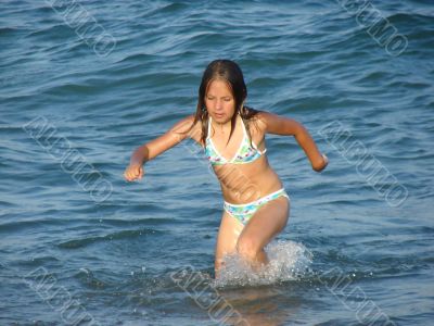 The girl running out from the sea
