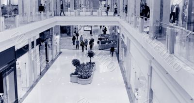 Shoppers at shopping center, motion blur. Tint blue #3