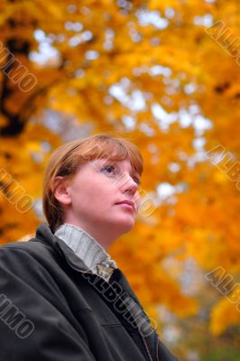 Woman look forward in autumn park #1