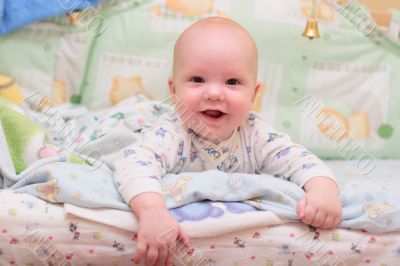 Baby rest on bed and look at camera #2