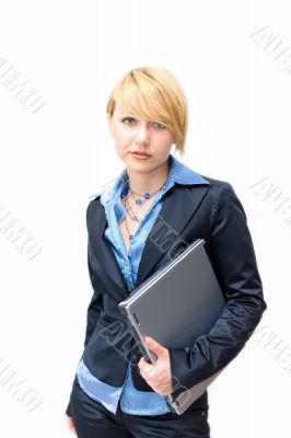 Businesswoman holding laptop under one`s arm