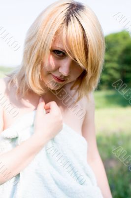 Attractive girl cover your body by towel on nature