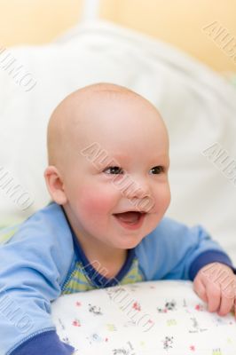 Enjoying baby on bed