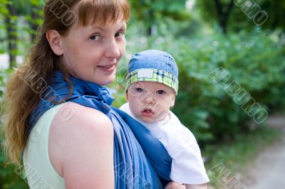 Mother carry baby in sling