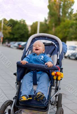Smiling baby in sitting stroller #12