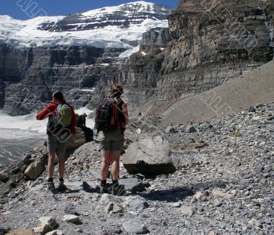 Hikers look out on valley Hikers look out on valley