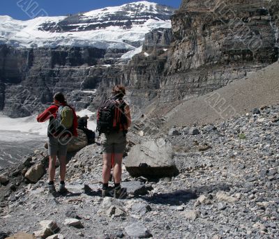 Hikers look out on valley