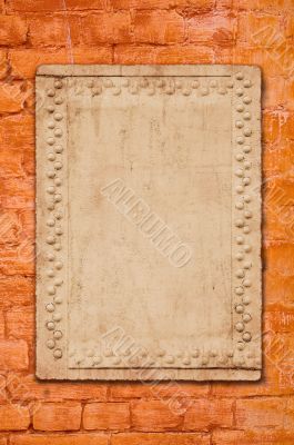 metal plate on brick wall - perfect grunge background