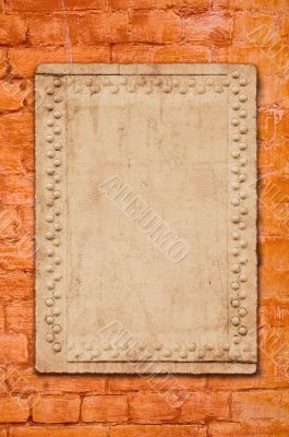 metal plate on brick wall - perfect grunge background