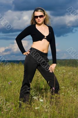 Portrait of the young beautiful girl on the nature