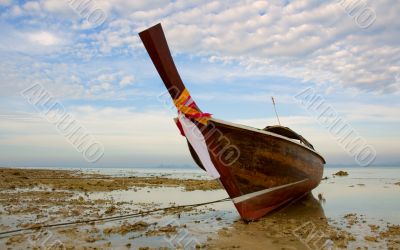 longtail boat in low tide, thailand