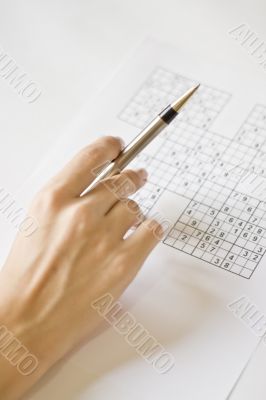 A hand on sudoku grid