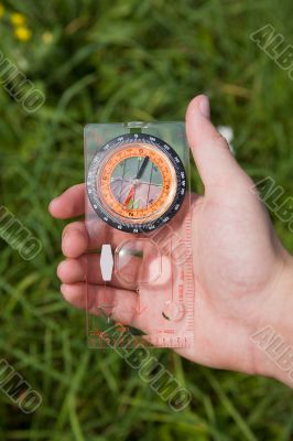 hand with compass