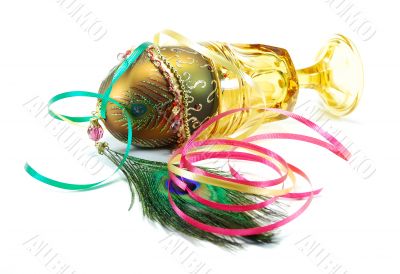 Decorated egg peacock feather and wine glass