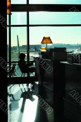 Woman reading at the airport