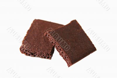 Blocks of porous chocolate isolated on white