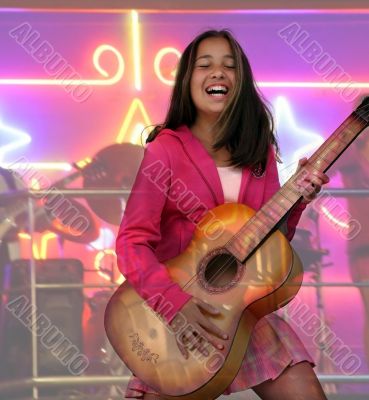 Happy teen girl with guitar
