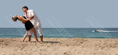 Couple dancing on the beach