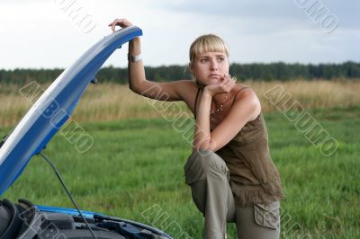 young woman with her broken car