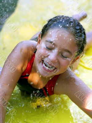 Happy girl playing with water
