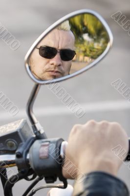 Punk in Motorcycle Rearview Mirror