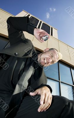 Frustrated Punk Businessman on his Cell Phone