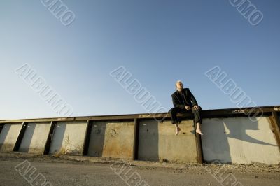 Punk Businessman on a Wall