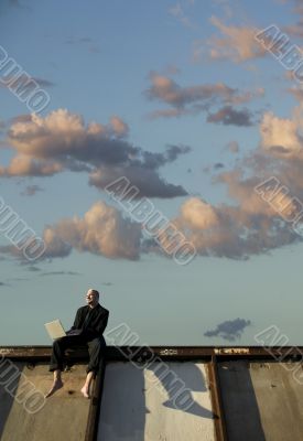 Barefoot Punk Businessman with Laptop Computer