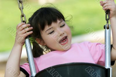 Cute girl swinging