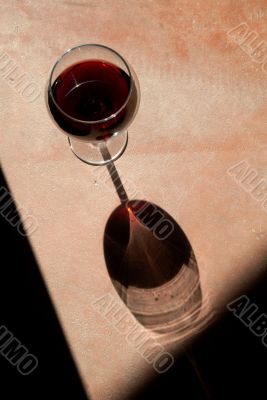 Wine Glass with Dramatic Shadow