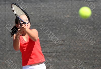 Young girl playing tennis