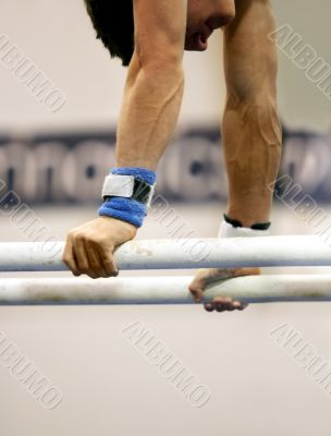 Gymnast on parallel bars