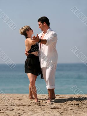 Couple dancing on the beach