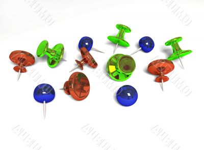 Colour pushpins on white background