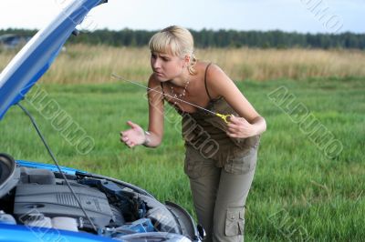 young woman with her broken car