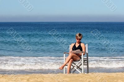 Woman reading on the beach