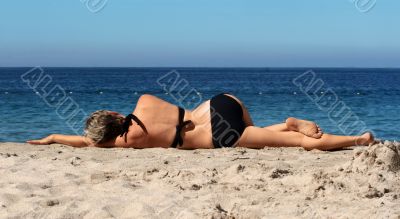 Woman relaxing on a beach