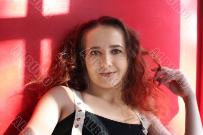 Happy smiling girl on red