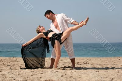 Couple dancing on the beach