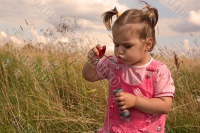 Baby with soap bubble