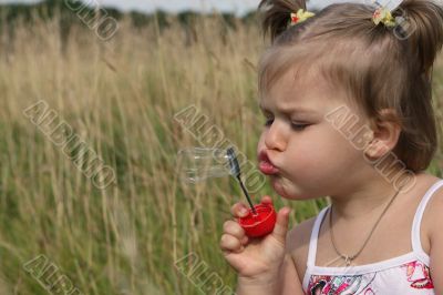 Baby with soap bubble