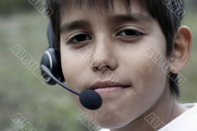 Young boy with phone headset