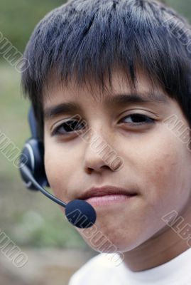 Young boy with phone headset