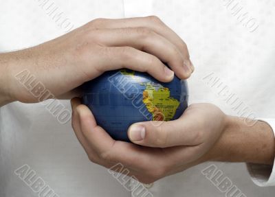 Businessman holding globe
