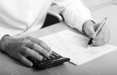 businessman calculating expenses at tax time