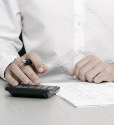 businessman calculating expenses at tax time