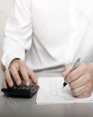businessman calculating expenses at tax time businessman calculating expenses at tax time