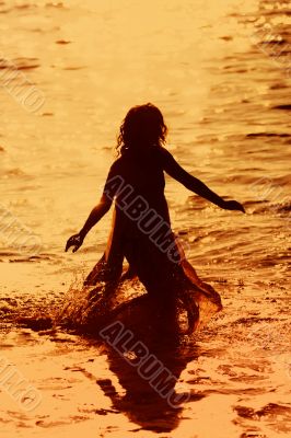 Girl running in the water
