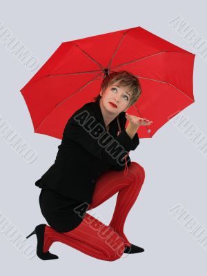 Businesswoman with a red umbrella